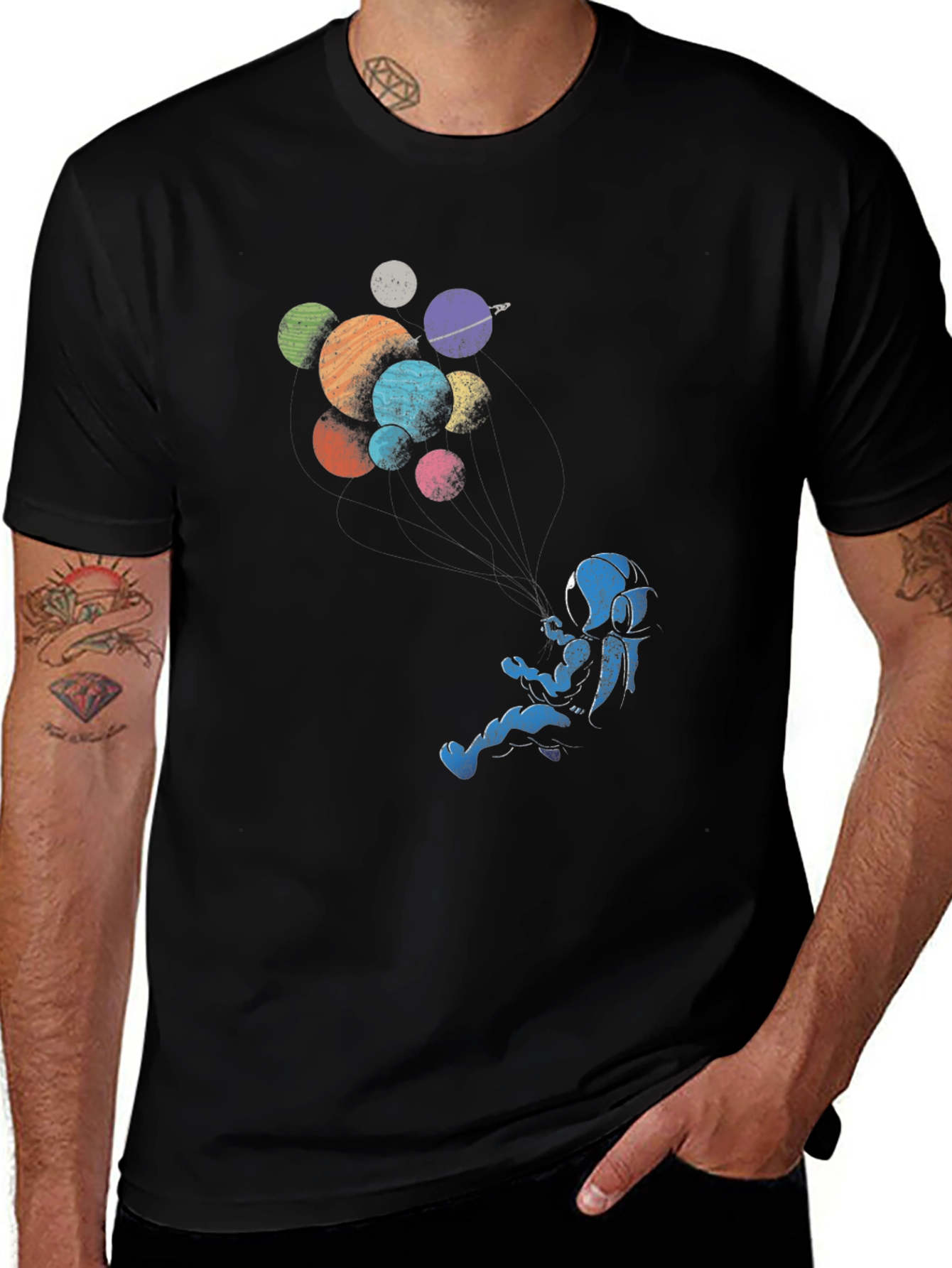 Astronaut Floating Among Planets Graphic Tee
